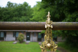 Fototapeta Londyn - decorative golden bell hanging in the garden