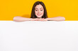 © deagreez - Photo of satisfied funky girl hide behind empty space blank look down isolated on yellow color background