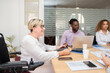 © Renata Hamuda - a woman leader in the wheelchair at the business meeting