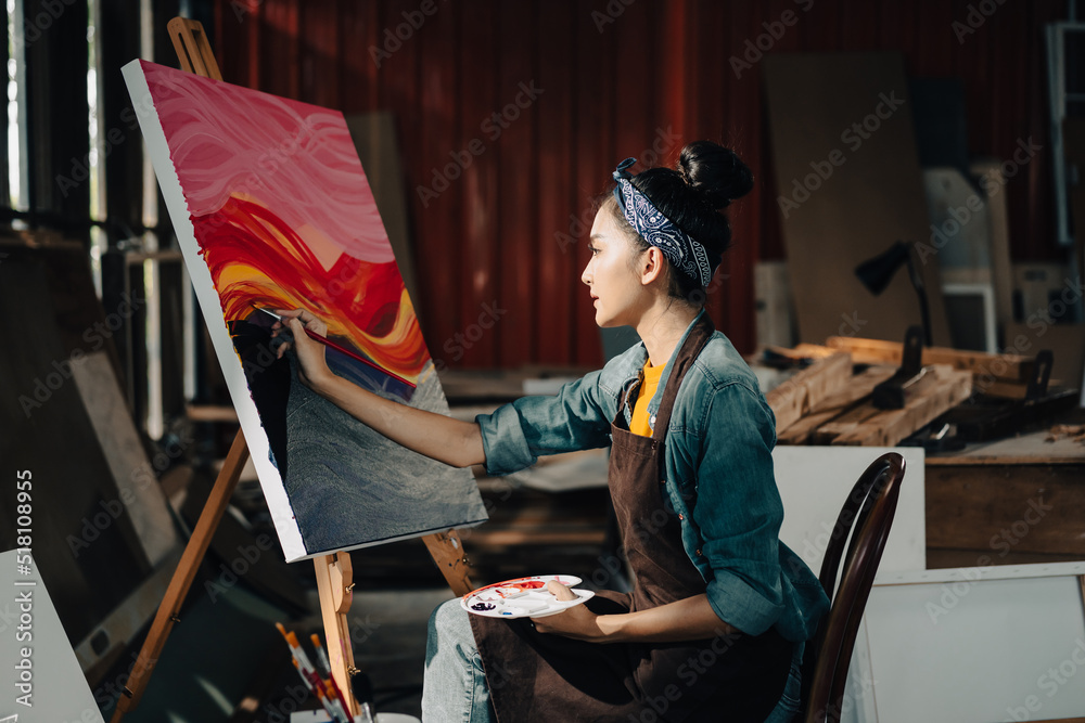 Asian Female Artist Draws create art piece with palette and brush ...