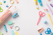 School accessories concept. Top view photo of pens pencil-case staplers binder clips adhesive tape scissors round correction tape sharpeners and erasers on isolated white background with copyspace