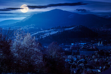 Wall Mural - carpathian rural landscape in autumn at night. village in the valley at the foot of the mountain. be