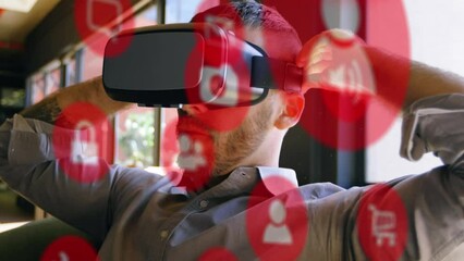 Poster - Animation of digital icons over caucasian businessman wearing vr headset