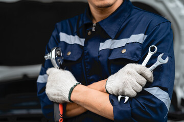 Wall Mural - close-up of auto mechanic car repair service car safety check The engine in the garage. Repair service concept.