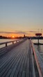 Leinwandbild Motiv Sonnenuntergang auf der Seebrücke