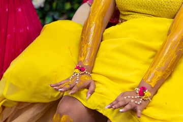 Indian pre wedding turmeric haldi ceremony bride's hands close up