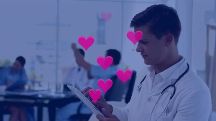 Poster - Animation of falling hearts icons over diverse group of doctors