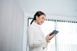 © mojo_cp - Asian businesswoman working with tablet Start up small business owner. business successful technology concept