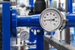 © Aleksandr Matveev - Industrial  concept. equipment of the boiler-house, - valves, tubes, pressure gauges, thermometer. Close up of manometer, pipe, flow meter, water pumps and valves of heating system in a boiler room.