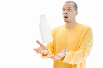 A white plastic bottle flying above the men's hands is isolated on a white background. A surprised man with an open mouth. Object. One. Pack. Person