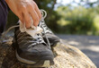 Close-up of a hands cleaning sports shoes. Selective focus and copy space