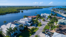 Aerial View Of A River In Naples, Florida With Real Estate Property And Mangroves