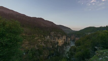 Wall Mural - Time lapse from dawn in the early morning with twilight to sunrise over Osumi Canyon, Albania