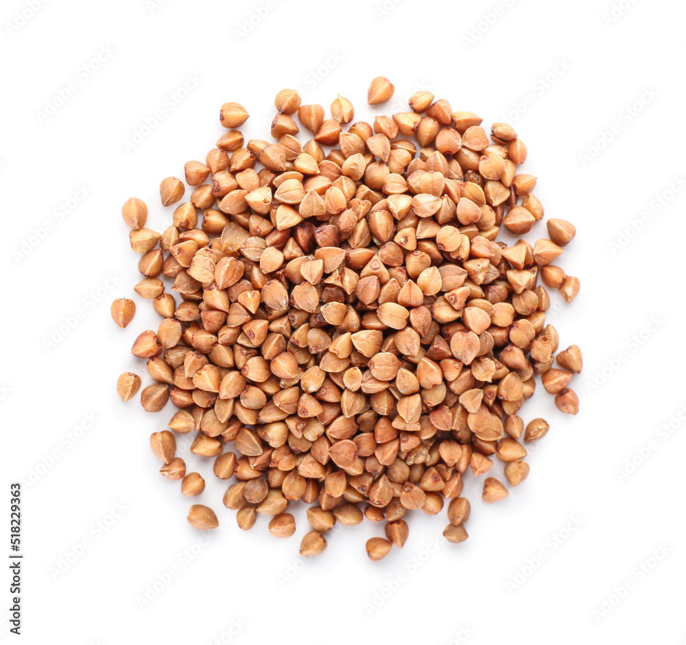 Heap of buckwheat grains on white background
