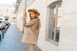 © Svetlana Sokolova - Fashion outdoor photo of stylish blond woman with perfect wavy hairs in beige hat and casual suit.