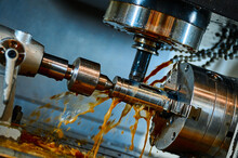 Lathe Machine Tool Operates With Metal Part In Workshop