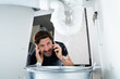 © Andrey Popov - Worried Man Calling Plumber