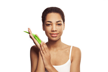 Wall Mural - Young woman holding green aloe vera plant leaf isolated on white background