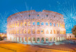 Colosseum amphitheater in Rome with fireworks at twilight blue hour - Rome, Italy