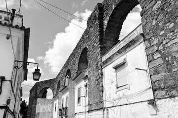 Wall Mural - Evora aqueduct. Black and white photo of Portugal.