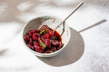 Wall Mural - Roasted cherries. Baked sweet cherry berries with balsamic vinegar and herbs. Delicious breakfast idea. Close-up.