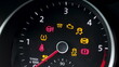 © uflypro - Many different car dashboard lights with warning lamps illuminated. Light symbol that pops up on dashboard when something goes wrong with the engine