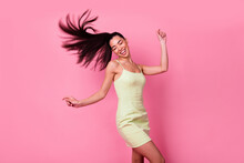 Photo Of Adorable Cute Positive Lady Go Crazy On Dancing Floor Wear Mini Dress Isolated On Pink Color Background