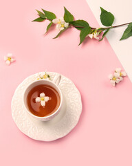 Wall Mural - Jasmine tea on color background.