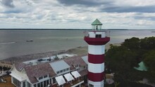 A Medium-wide Orbiting Drone Shot Of The Lighthouse At Harbor Town On Hilton Head Island, SC