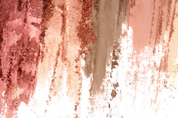 Broken and smashed make-up eyeshadow pallete, lay of brush strokes, close-up for background, top view