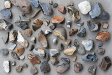 A Closeup Of Knapped Fild Flint Stones Pebbes Background.