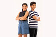 © IndiaPix - Cheerful boy and girl standing back to back with crossed arms