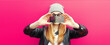 Leinwandbild Motiv Close up of modern young woman stretching her hands taking selfie with smartphone on pink background