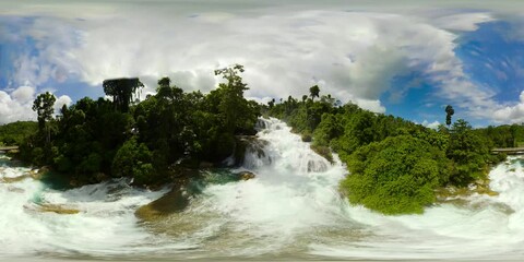 Wall Mural - Aerial view of Aliwagwag Falls in a mountain gorge in the tropical jungle, Philippines, Mindanao. Waterfall in the tropical forest. 360 panorama VR.