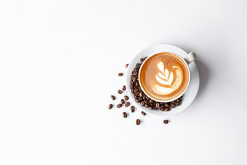 cup of coffee and bean on white table background. top view