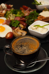 Wall Mural - a cup of Americano on the background of food in a cafe