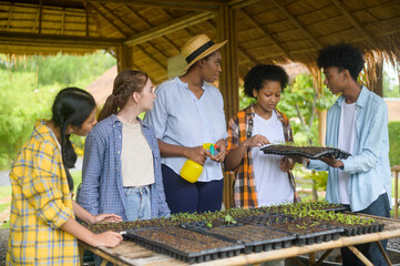 Wall Mural - Group of mixed race students and teacher learning agriculture  technology in smart farming , education ecology agricultural concepts .