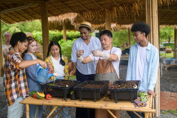 Wall Mural - Group of mixed race students and teacher learning agriculture  technology in smart farming , education ecology agricultural concepts .