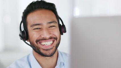 Fototapete - A male call center or telecom agent happy and smiling after providing good customer service. Young business man talking on a video conference call looking at PC wearing headset working from home