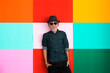 © Marko/Stocksy - Portrait of senior man colorful background, retirement