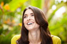 Close-up Beauty Portrait Of Beautiful Woman Laughing In A Garden