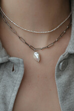 Closeup Beautiful Necklaces With Silver Chains And Pearls 