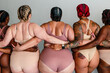 © Erin Brant/Stocksy - Back view of curvy women in underwear