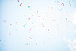 © Irina Efremova/Stocksy - Sky confetti flying in the sky during Pride parade