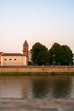 Pisa At Sunset With Full Moon Over A Church