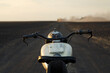 © Danil Nevsky/Stocksy - Motorbike on countryside road at sunset