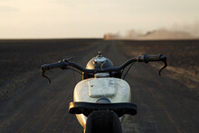 Motorbike On Countryside Road At Sunset