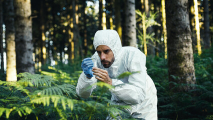 scientist analyzes an endangered plant