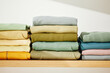 © Martí Sans/Stocksy - Many cotton clothes on table