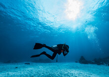 Woman Diving At The Andaman Sea / Thailand